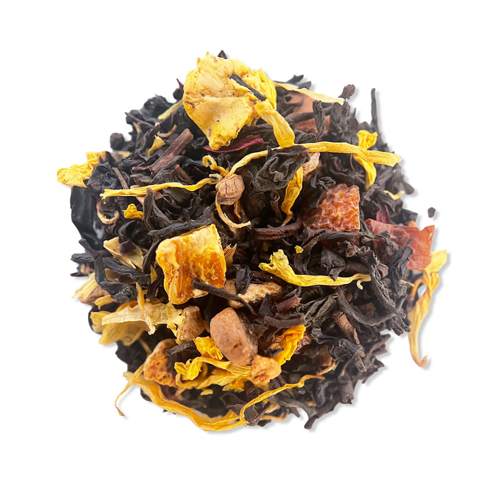 Loose Pumpkin Spice Tea with dark tea leaves and yellow flower petals on a white background